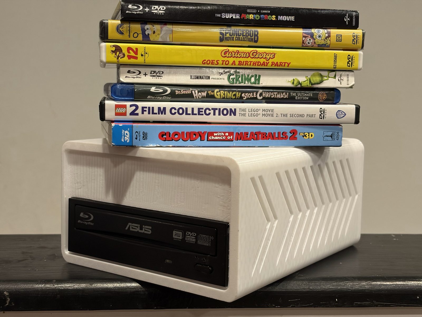 The finished Riparr ripper box with a stack of Blu-ray and DVD cases sitting on top